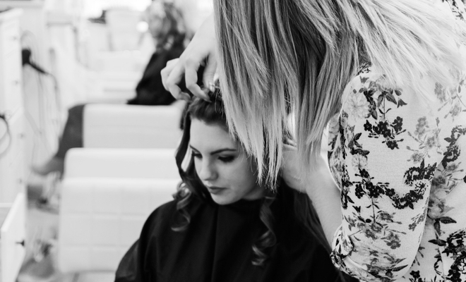 Woman getting her hair styled